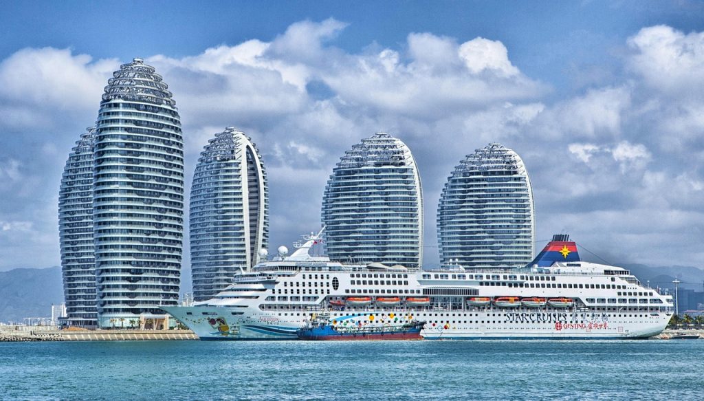 ship, city, harbor, port, bay, water, skyscrapers, hotels, modern buildings, buildings, island, phoenix island, nature, urban, skyline, ocean liner, passenger ship, cruise ship, superstar aquarius, sanya bay, hainan, china